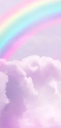 This captivating phone live wallpaper boasts a rainbow shimmering among heavenly clouds
