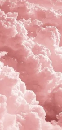 This live wallpaper features a beautiful pink sky and an array of fluffy clouds, perfect for creating a peaceful and calming effect on your phone