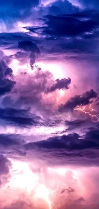 This stunning phone live wallpaper features a captivating sky filled with billowing clouds and bolts of lightning