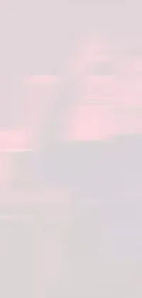 This mobile live background features a snowboarding man atop a snow-covered slope, amidst low-quality footage and pastel pink hues