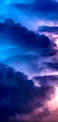This live wallpaper for your phone showcases a stunning sky filled with storm clouds, conjuring up feelings of awe and wonder