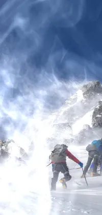 This phone live wallpaper is a captivating winter scene capturing skiing in the mountains