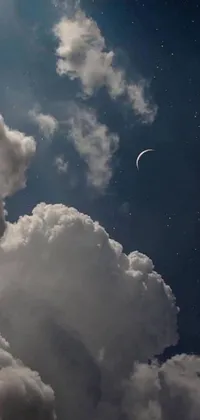 This live wallpaper displays a mesmerizing black and white photograph of a crescent moon in the sky, enhanced by magic realism