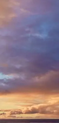 This live wallpaper features a panoramic view of the sky with a dreamy, heavenly cloudy sky in shades of purple and orange