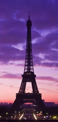 This phone live wallpaper showcases a stunning dusk view of the iconic Eiffel Tower in Paris, France