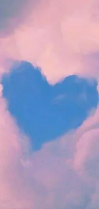 This breathtaking live phone wallpaper features a heart-shaped cloud in shades of blue and pink, set against a star-filled sky and the major arcana tarot cards