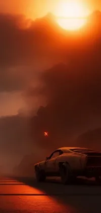 This stunning live wallpaper features a vintage car abandoned on the roadside in a sunset desert landscape