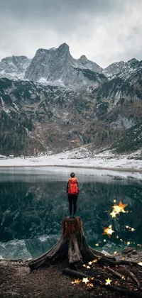 Transform your phone into a mesmerizing winter wonderland with this live wallpaper featuring a serene lake setting