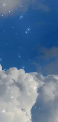 This phone live wallpaper showcases a majestic plane gliding through fluffy cumulus clouds