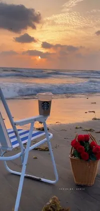 This mobile phone's live wallpaper showcases an idyllic beach chair placed on the sandy shoreline, surrounded by a serene and exotic environment