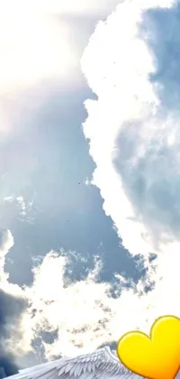 This captivating live wallpaper depicts an image of a heart with wings soaring through the sky