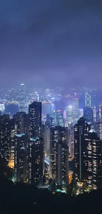 Experience the futuristically stunning cityscape of Hong Kong at night with this live wallpaper