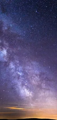 This live wallpaper showcases a night sky filled with shimmering stars next to a peaceful body of water