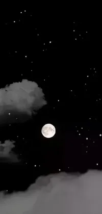 This live phone wallpaper features a modern black and white photo of a full moon against a night sky filled with stars and clouds