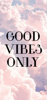 This live phone wallpaper features a motivational message, &quot;good vibes only&quot; above a cloud background