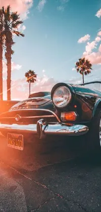 This live wallpaper for phones showcases an image of a classic car parked on the side of the road