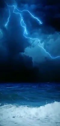 Get mesmerized by this phone live wallpaper featuring a scenic view of a vast body of water, amid a cloudy and stormy sky, complemented by blue lightning bolts