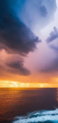 This phone live wallpaper portrays a vast, stormy ocean under a cloudy sky