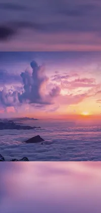 Feast your eyes on a serene live wallpaper for your phone! This picturesque view boasts a colossal body of water surrounded by warm glowing clouds