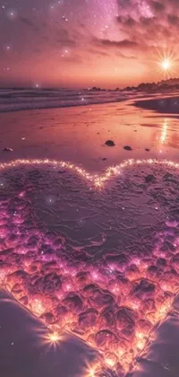 This live phone wallpaper showcases a heart-shaped arrangement of glowing lights on a serene beach