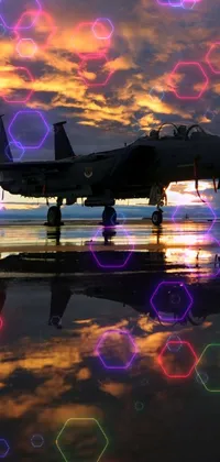 Get ready to soar with this stunning Fighter Jet live wallpaper! Designed by Chris Moore, this magical wallpaper features a sleek fighter jet parked on a tarmac against a spectacular Idaho morning sunrise, ready to take off for its next mission
