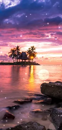 This mobile live wallpaper depicts a serene sunset over a body of water, with unique rocks in the foreground