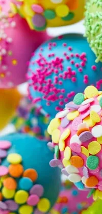 Indulge your sweet tooth with this delightful phone live wallpaper featuring cake pops covered in sprinkles