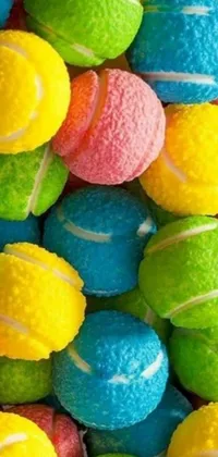 Looking for an engaging live wallpaper for your phone? Check out this candy-coated, pastel colored image of a pile of tennis balls! The colors are bright, playful, and eye-catching, creating a fun and lively atmosphere