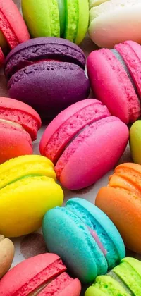 Looking for a colorful and vibrant phone wallpaper? Check out this striking live wallpaper featuring a pile of macarons! The gorgeous close-up view showcases the hot colors like pink, purple, blue, green, and yellow that make up these delicious-looking treats