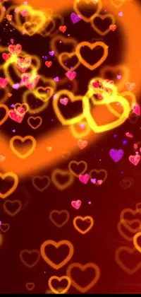Get lost in a stunning screensaver with this live wallpaper for your phone! Featuring a beautiful display of flying hearts in shades of purple and orange, this wallpaper creates a warm and inviting atmosphere on your screen