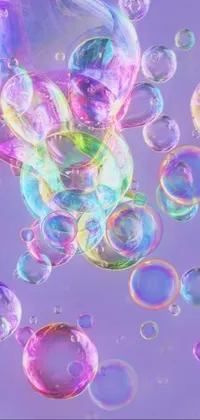 This live wallpaper features a gorgeous arrangement of floating bubbles in a soft, Lisa Frank-inspired design