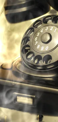 This live wallpaper showcases an old-style telephone and other vintage elements such as a pen and a photo on a desk