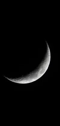 Set a mesmerising live wallpaper on your phone with this stunning black and white photograph of a half moon