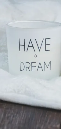 This phone live wallpaper is a stunning design, featuring a frosted cup with the words "have a dream" written in elegant font