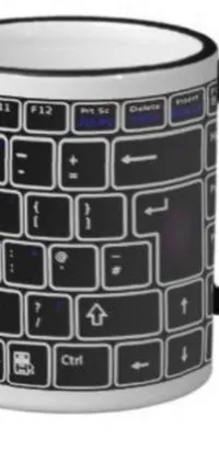 This phone live wallpaper showcases a striking black and white computer keyboard coffee mug image