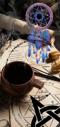 Looking for a captivating and unique live wallpaper for your phone? Look no further than this stunning design featuring a steaming cup of coffee on a table surrounded by vanitas elements such as magical runes and dark flower shamans
