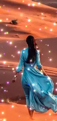 This captivating phone live wallpaper takes us to a mystical desert setting where a woman dressed in blue walks in pure elegance