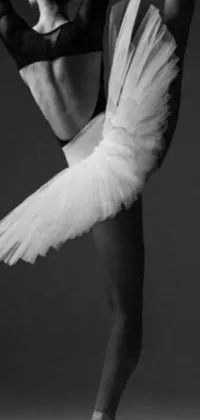 This phone live wallpaper showcases a stunning black and white photograph of a ballerina in a side view close-up, with large wings framing her figure