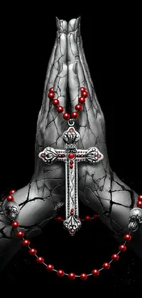 Get lost in deep spiritual devotion with this stunning gothic live wallpaper featuring a person holding a cross