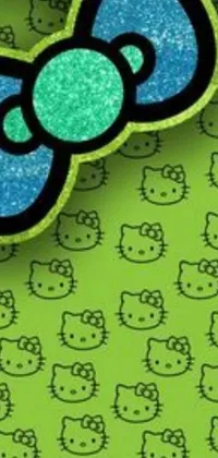 This phone live wallpaper features an adorable Hello Kitty bow placed on top of a vibrant green background
