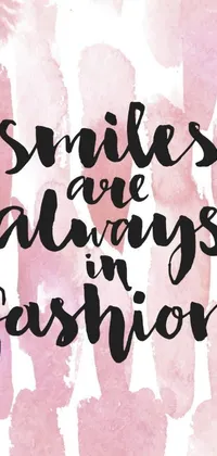 This phone live wallpaper is designed with a stunning watercolor background in pink and features the phrase "smiles always fashion" boldly scripted in black font