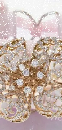 This live wallpaper showcases a stunning golden bracelet adorned with a blooming flower, set against a luxurious background of lace, ribbons, pink diamonds, and champagne