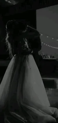 This live wallpaper features a stunning black and white photo of a bride and groom on the dance floor