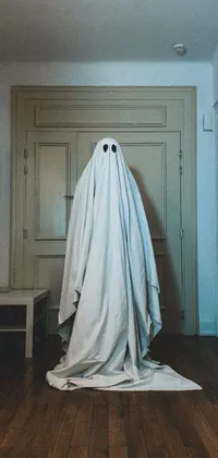 Spook up your phone with our live wallpaper of a haunting ghost standing in the corner of a room
