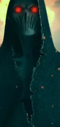 This live wallpaper features a hooded figure standing in front of an intense fire, creating a mysterious and eerie atmosphere