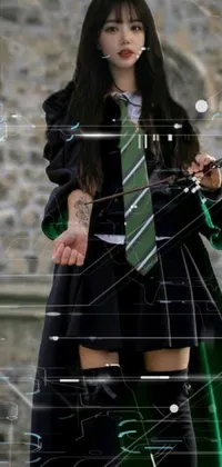 Looking for a stunning live wallpaper for your phone? Check out this enthralling design featuring a woman with long black hair, green tie, and wand with a long trunk