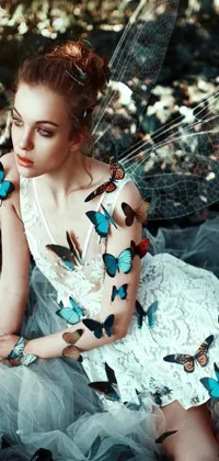 This stunning live phone wallpaper showcases a woman in a white dress surrounded by a swarm of colorful butterflies