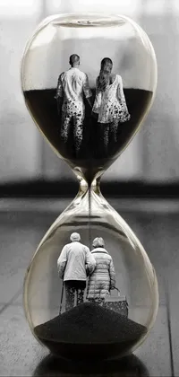 Looking for a stunning live wallpaper? Check out this black and white photo of a family in an hourglass