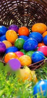 This live phone wallpaper offers a beautiful depiction of a basket filled with colorful Easter eggs