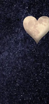 This live wallpaper features a heart shaped object in a stunning night sky
